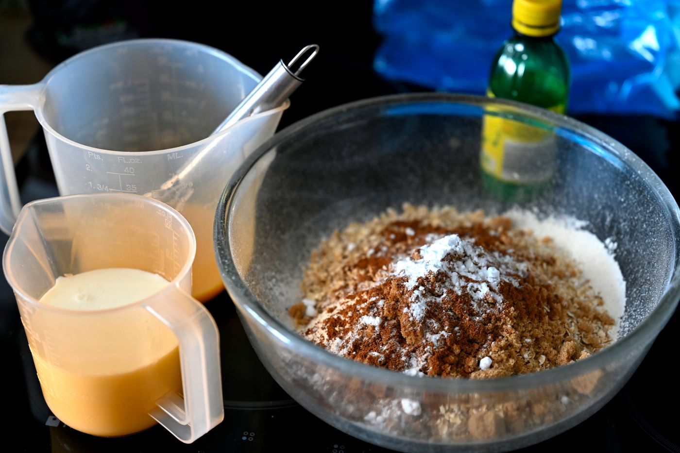 Baking ingredients arranged in a glass mixing bowl
