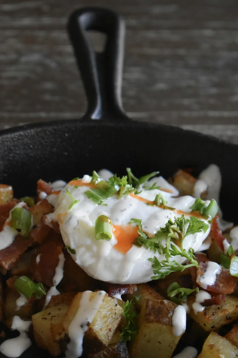 A close view of food cooking in a black skillet