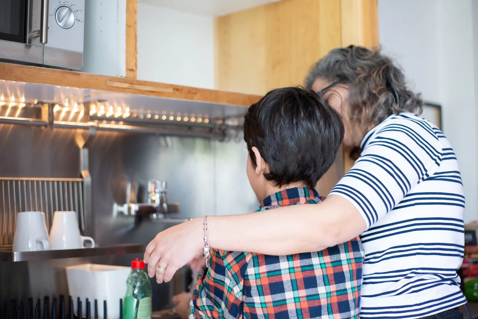 Mother and child cooking together