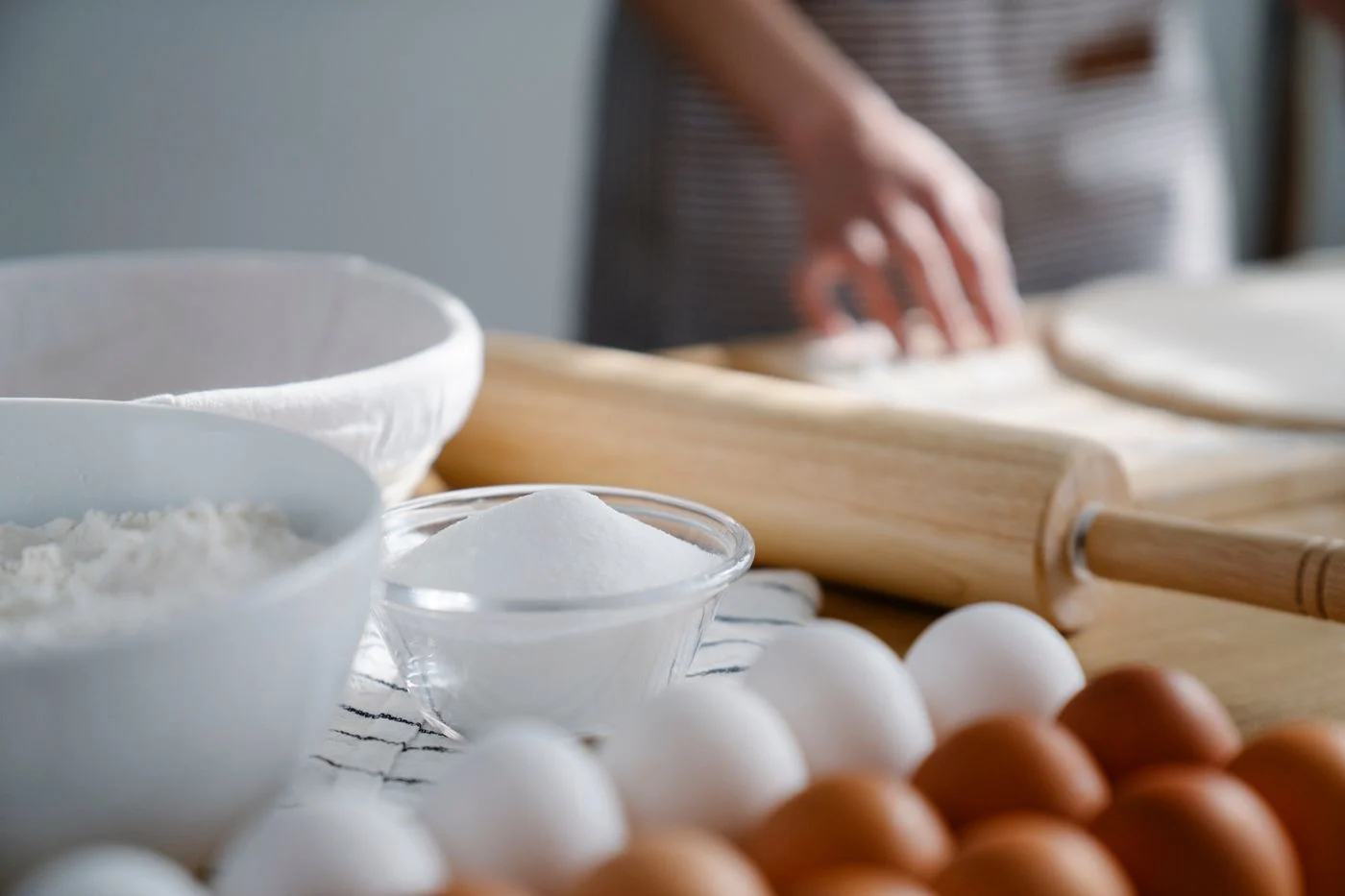 Baking ingredients and a rolling pin on a work surface