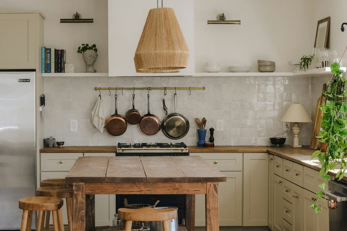 rustic kitchen with wooden island and stools