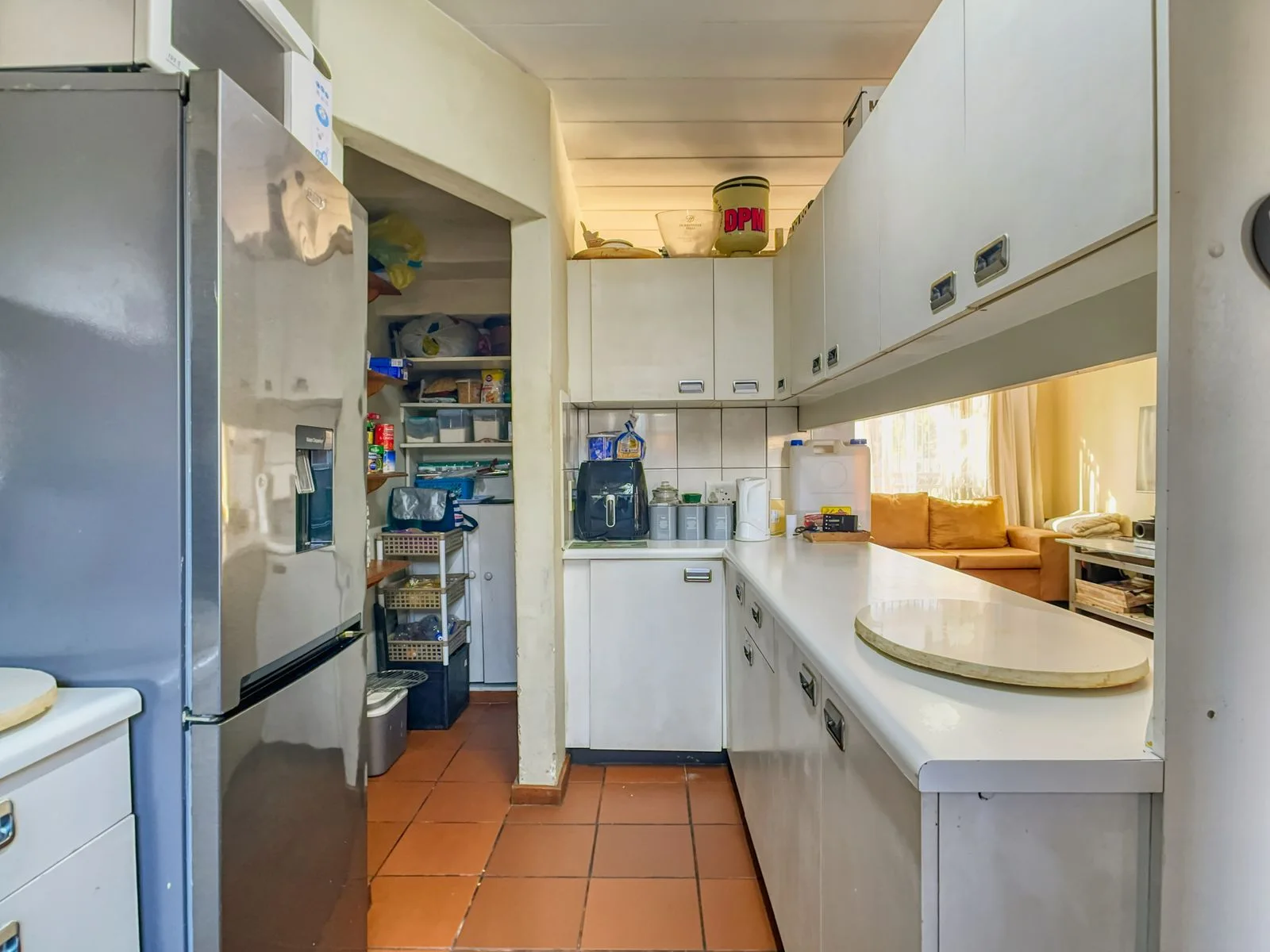 A bright kitchen with pantry shelving